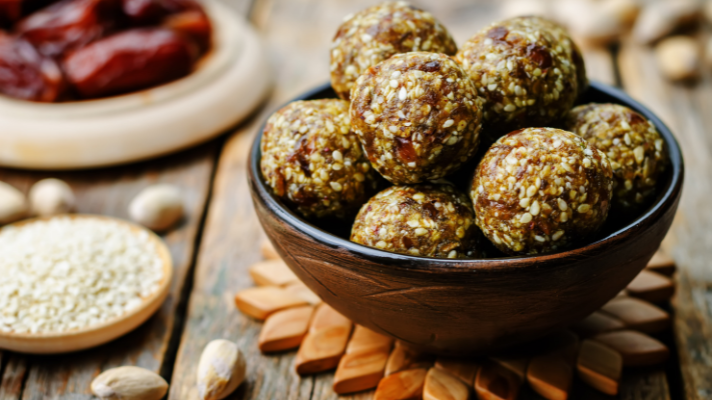 Date and pistachio bites in a bowl.